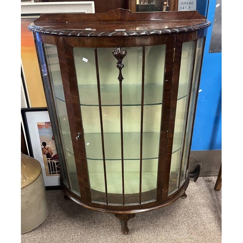 163 - WALNUT DISPLAY CABINET WITH SINGLE GLAZED PANEL DOOR OPENING TO GLASS SHELVED INTERIOR ON SHAPED SUP... 