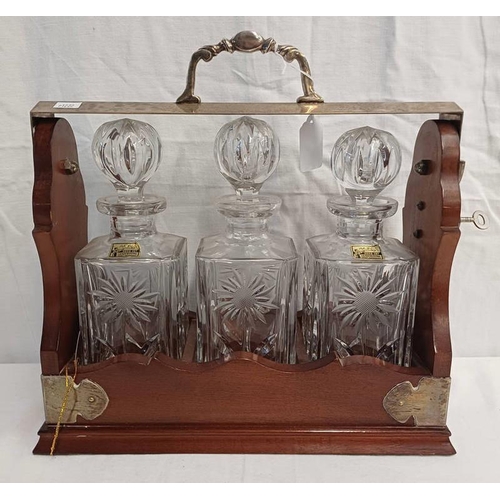 3163 - OAK TANTALUS WITH METAL FIXTURES AND 3 AVON CUT-GLASS DECANTERS