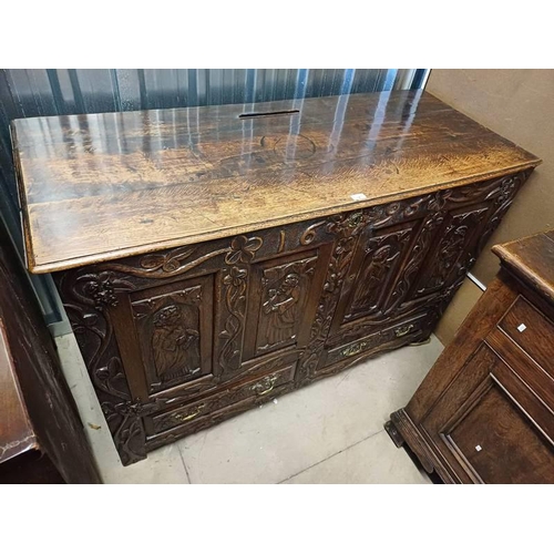 4 - OAK CABINET WITH 2 PANEL DOORS WITH CARVED CLASSICAL SCENE DECORATION OVER 2 DECORATIVE CARVED DRAWE... 