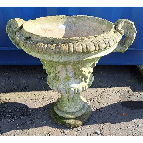 521 - RECONSTITUTED STONE GARDEN URN ON CIRCULAR PLINTH BASE. 56 CM TALL