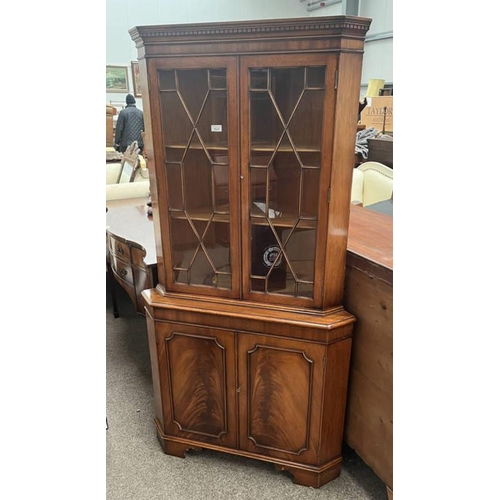 523 - MAHOGANY CORNER CABINET WITH 2 ASTRAGAL GLASS PANEL DOORS OVER 2 PANEL DOORS ON BRACKET SUPPORTS