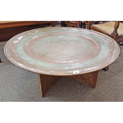 59 - LARGE COPPER MIDDLE EASTERN STYLE CIRCULAR TRAY WITH ETCHED DECORATION ON STAND. DIAMETER 96 CM