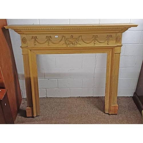63 - PINE FIRE SURROUND WITH DENTIL CORNICE & CARVED DECORATION. INNER DIMENSIONS 109 CM TALL X 110 CM WI... 