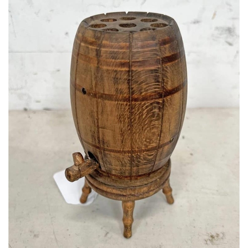 1573 - CARVED WOODEN POP UP CIGARETTE DISPENSER IN THE FORM OF A WHISKY BARREL ON A STAND, 15CM TALL