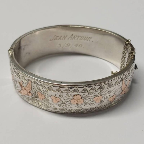 324 - SILVER & GOLD HINGED BANGLE WITH FLORAL & BIRD DECORATION - 6CM INNER WIDTH