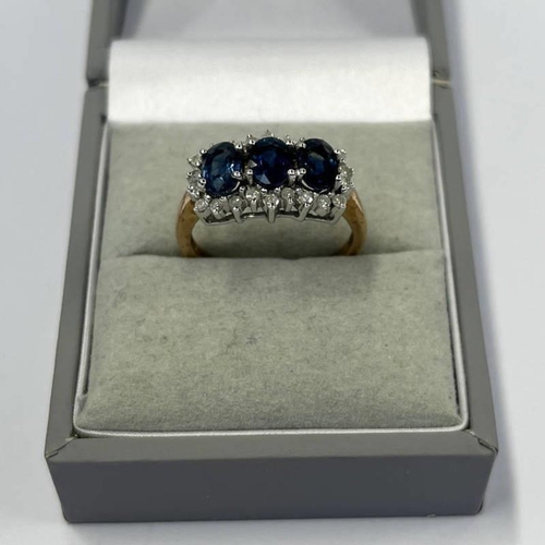 346 - 9CT GOLD SAPPHIRE & DIAMOND CLUSTER RING WITH 3 OVAL SAPPHIRES IN A SURROUND OF DIAMONDS - RING SIZE... 