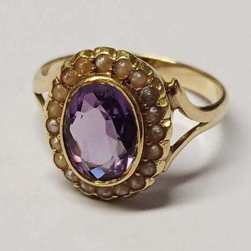 408 - EARLY 20TH CENTURY PEARL & AMETHYST CLUSTER RING, THE OVAL AMETHYST IN A SURROUND OF SEED PEARLS