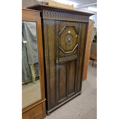 5050 - EARLY 20TH CENTURY OAK SINGLE DOOR WARDROBE WITH CARVED DECORATION LABELLED JENNER'S PRINCES STREET,... 