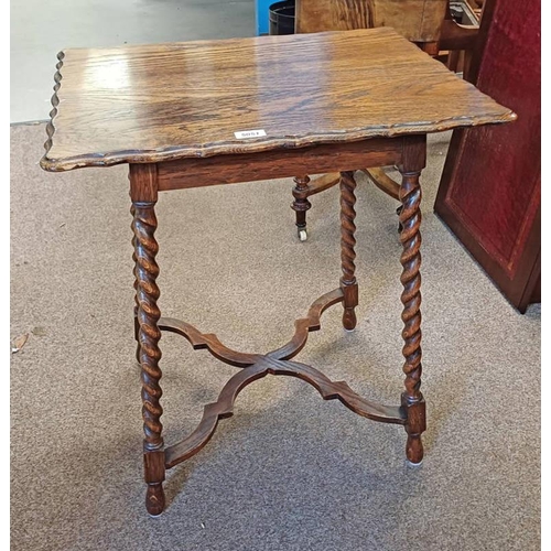 5051 - EARLY 20TH CENTURY OAK TABLE WITH SHAPED TOP ON BARLEY TWIST SUPPORTS WITH UNDERSTRETCHER, 72CM TALL... 