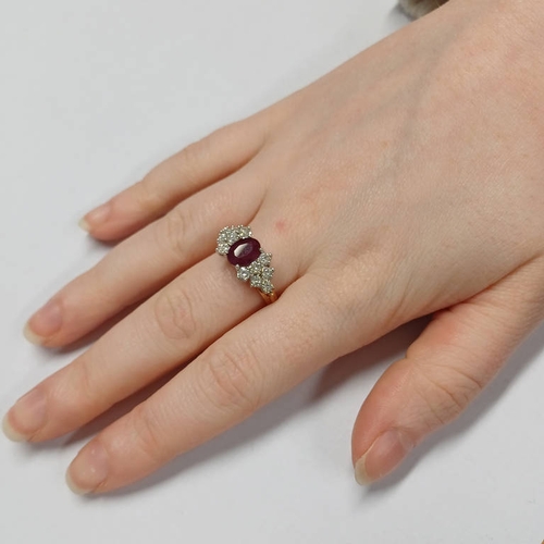 389 - 18CT GOLD RUBY & DIAMOND CLUSTER RING, THE OVAL RUBY SET WITHIN A SURROUND OF DIAMONDS VERY APPROX. ... 