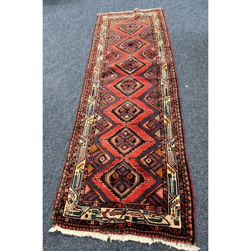 1551 - TERRACOTTA GROUND PERSIAN SUROK RUNNER WITH DIAMOND MEDALLION DESIGN - 252 X 87 CM