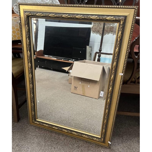 330 - DECORATIVE GILT FRAMED RECTANGULAR MIRROR WITH BEVELLED EDGE.  INNER DIMENSIONS : 58 X 85 CM