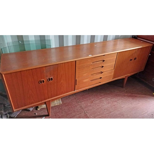 6 - TEAK SIDEBOARD WITH 5 CENTRALLY SET DRAWERS FLANKED ON EACH SIDE BY 2 PANEL DOORS ON TAPERED SUPPORT... 