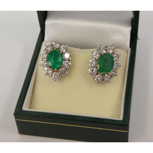 104 - PAIR OF EMERALD & DIAMOND CLUSTER EARRINGS, EACH OVAL EMERALD SET WITHIN A SURROUND OF 10 DIAMONDS A... 