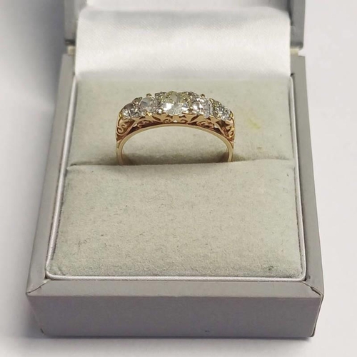 138 - EARLY 20TH CENTURY 18CT GOLD 5-STONE DIAMOND SET RING IN SCROLL SETTING, THE OLD CIRCULAR CUT DIAMON... 
