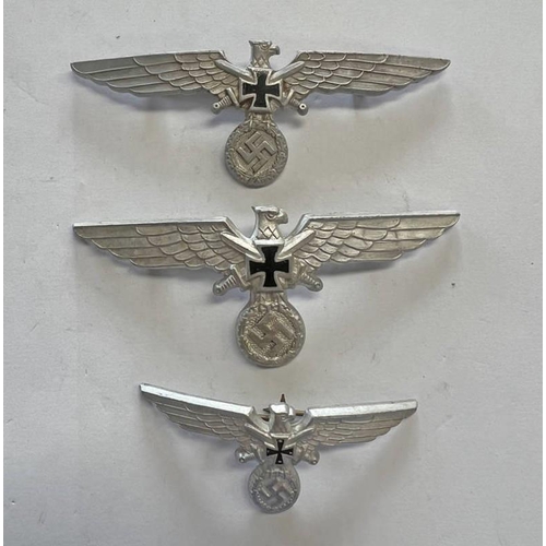 1392 - THREE WW2 STYLE NSKOV EAGLES, ALL MARKED TO REAR GES GESCH ETC.