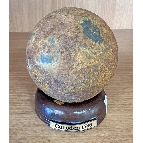 1452 - SOLID IRON CANNON BALL, 10CM ACROSS, 3.9KG, ON AN ASSOCIATED WOODEN BASE AND PLAQUE MARKED 'CULLODEN... 