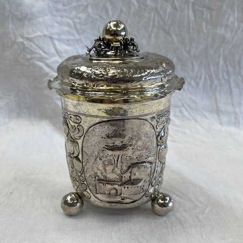 158 - 19TH CENTURY CONTINENTAL WHITE METAL LIDDED POT WITH APPLE FINIAL, EMBOSSED DECORATION & 3 BALL FEET... 
