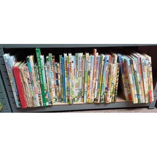 2100 - SELECTION OF RUPERT THE BEAR ANNUALS AND BOOKS OVER VARIOUS YEARS OVER ONE SHELF