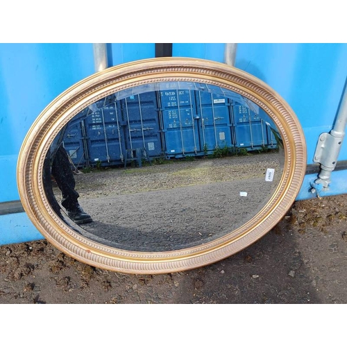 5087 - GILT FRAMED OVAL MIRROR WITH BEVELLED EDGE.  INNER DIMENSIONS  8 X 69 CMS