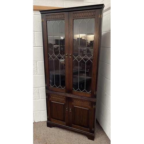 5462 - OAK ERCOL CABINET WITH LEADED GLASS WITH DECORATED PANELS OVER 2 PANEL DOORS