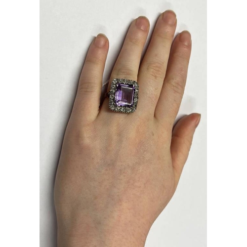 26 - 18CT GOLD AMETHYST & DIAMOND CLUSTER RING, THE RECTANGULAR CUT AMETHYST APPROX. 9.05 CARATS SET WITH... 