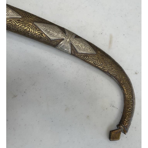 1261 - MIDDLE EASTERN JAMBIYA WITH 20.5CM LONG CURVED BLADE, WHITE METAL AND BRASS HILT AND SCABBARD