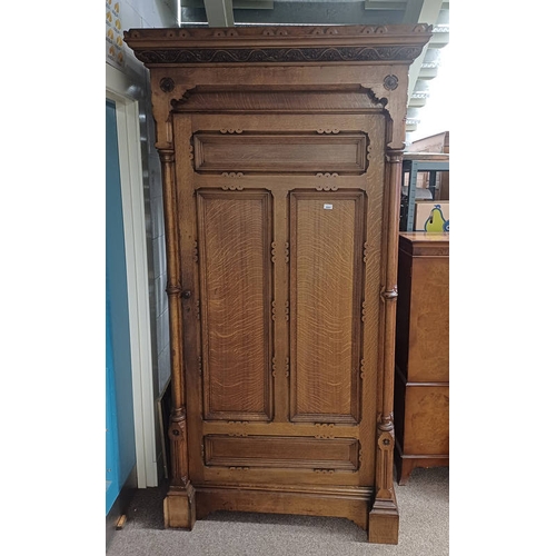 5091 - EARLY 20TH CENTURY CARVED OAK WARDROBE WITH SINGLE PANEL DOOR.  193 CM TALL
