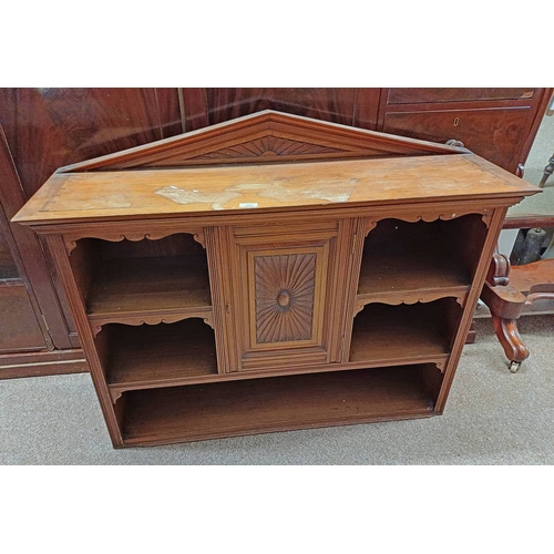 105 - LATE 19TH CENTURY MAHOGANY BOOKCASE WITH CENTRALLY SET CARVED PANEL DOOR.  88 CM TALL X 110 CM WIDE