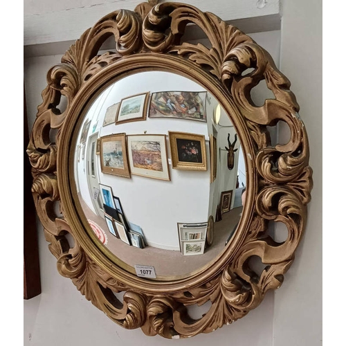 1077 - GILT FRAMED PORTHOLE MIRROR, 33 CM DIAMETER (INSIDE FRAME)