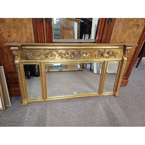 1125G - GILT FRAMED BEVELLED EDGE OVERMANTLE MIRROR IN 3 SECTIONS, DECORATED WITH FACES AND MYTHICAL BEASTS.... 