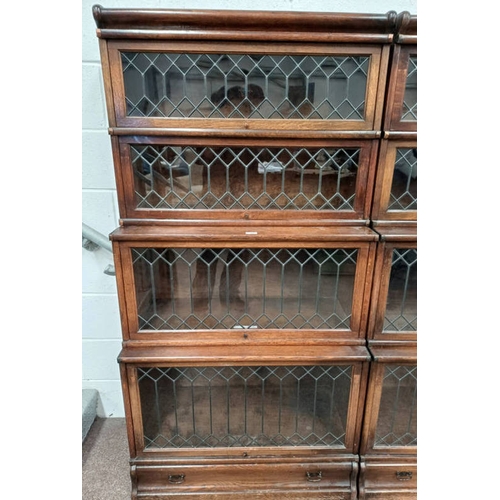 13 - GLOBE & WERNICKE OAK SECTIONAL BOOKCASE WITH 4 LEADED GLASS PANEL DOORS AND SINGLE DRAWER TO BASE. L... 