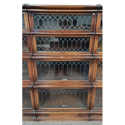 13A - GLOBE & WERNICKE OAK SECTIONAL BOOKCASE WITH 4 LEADED GLASS PANEL DOORS AND SINGLE DRAWER TO BASE. L... 