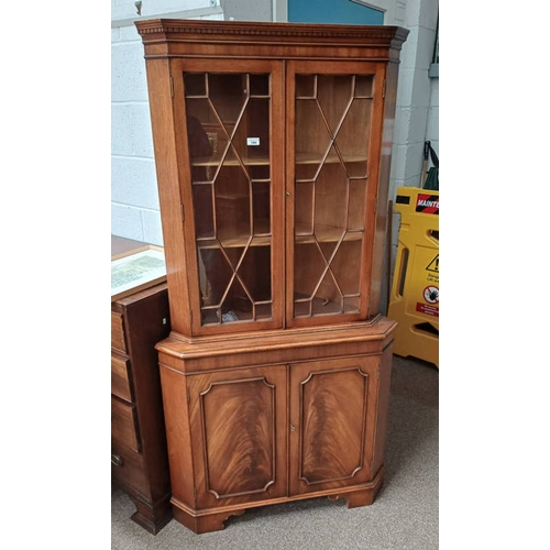 184 - LATE 20TH CENTURY MAHOGANY CORNER CABINET WITH 2 ASTRAGAL GLASS PANEL DOORS OVER 2 PANEL DOORS.  181... 