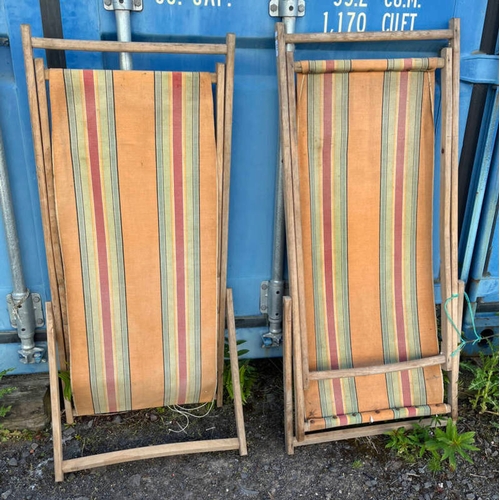 186 - PAIR OF OAK FRAMED FOLDING GARDEN LOUNGERS WITH AWNING SEATS.