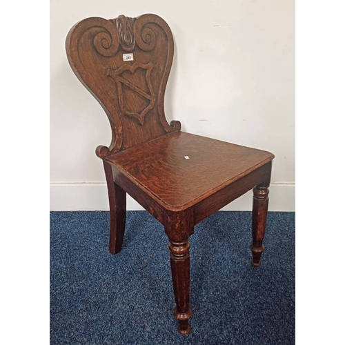 245 - LATE 19TH CENTURY OAK HALL CHAIR WITH CARVED SHIELD BACK