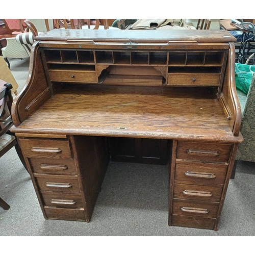 268 - EARLY 20TH CENTURY OAK ROLL TOP DESK WITH FITTED INTERIOR OVER TWIN PEDESTALS WITH 4 DRAWERS