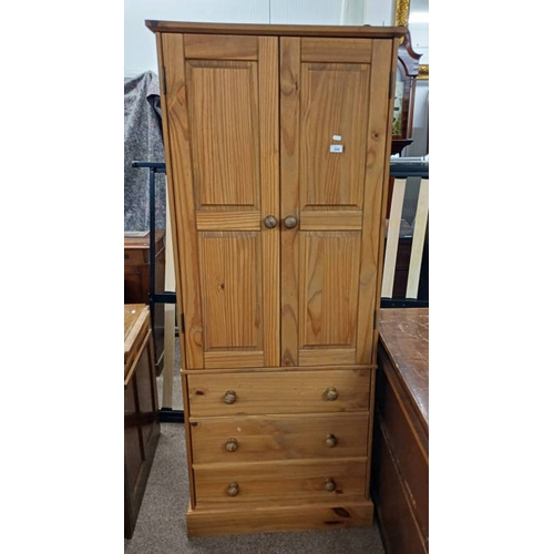 269 - PINE WARDROBE WITH 2 PANEL DOORS OVER 3 LONG DRAWERS ON PLINTH BASE