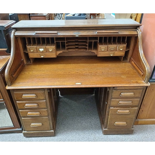 273 - EARLY 20TH CENTURY OAK ROLL TOP DESK WITH FITTED INTERIOR OVER TWIN PEDESTALS OF 4 DRAWERS. 125 CM T... 