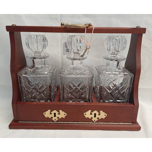 3032 - MAHOGANY CASED TANTALUS WITH 3 DECANTERS