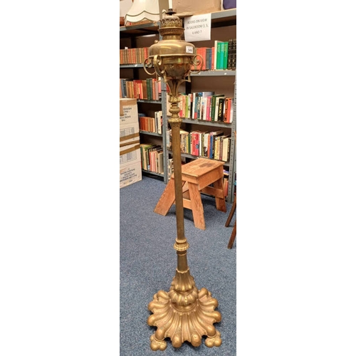 327 - LATE 19TH / EARLY 20TH CENTURY BRASS STANDARD OIL LAMP WITH REEDED COLUMN ON SHAPED BASE ON 4 PAW FE... 