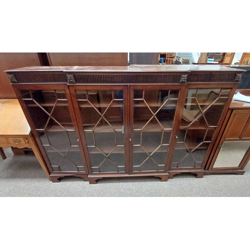 45 - EARLY 20TH CENTURY MAHOGANY BREAK FRONT BOOKCASE WITH 4 ASTRAGAL GLASS PANEL DOORS ON BRACKET SUPPOR... 