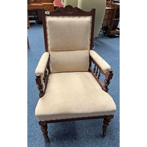 52 - LATE 19TH CENTURY MAHOGANY FRAMED GENTLEMAN'S ARMCHAIR ON TURNED SUPPORTS.