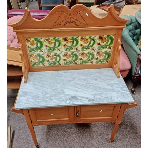 161 - LATE 19TH CENTURY MARBLE TOPPED SATIN BIRCH WASHSTAND WITH TILE INSET GALLERY TOP OVER 2 PANEL DOORS... 