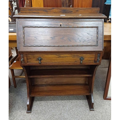 170 - ARTS & CRAFTS OAK STUDENTS DESK WITH FALL FRONT OVER SINGLE DRAWER WITH OPEN SHELVES BELOW.  106 CM ... 