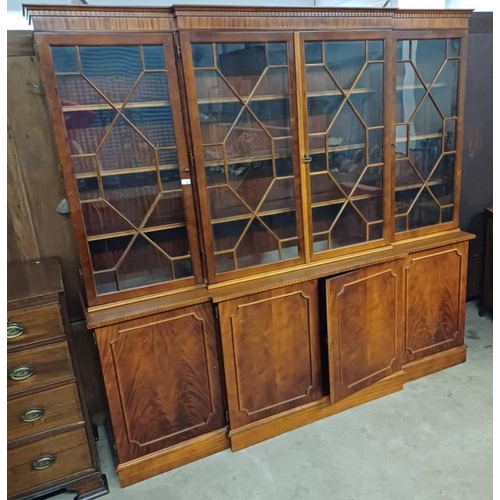 2 - 20TH CENTURY MAHOGANY BREAKFRONT BOOKCASE WITH 4 ASTRAGAL GLAZED DOORS OVER 4 PANEL DOORS ON PLINTH ... 