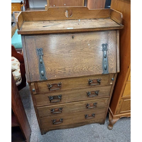 29 - EARLY 20TH CENTURY ARTS & CRAFTS STYLE OAK STUDENTS DESK WITH FALL FRONT OVER 4 DRAWERS.  115 CM TAL... 