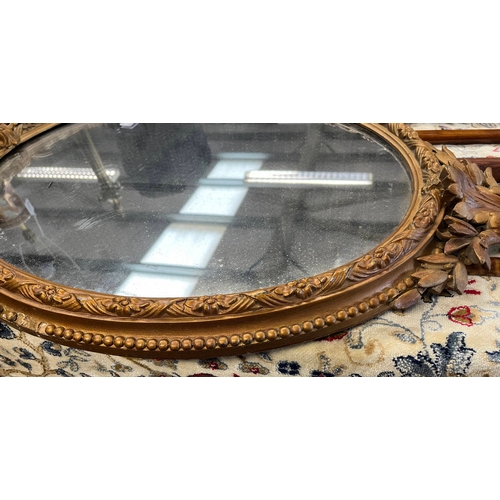 265 - 20TH CENTURY GILT FRAMED OVAL MIRROR, HEIGHT 86CM