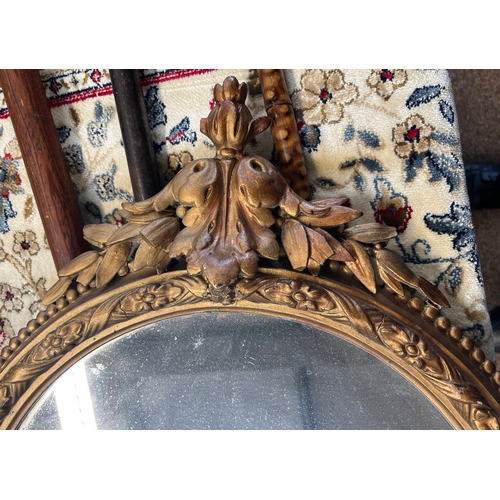 265 - 20TH CENTURY GILT FRAMED OVAL MIRROR, HEIGHT 86CM