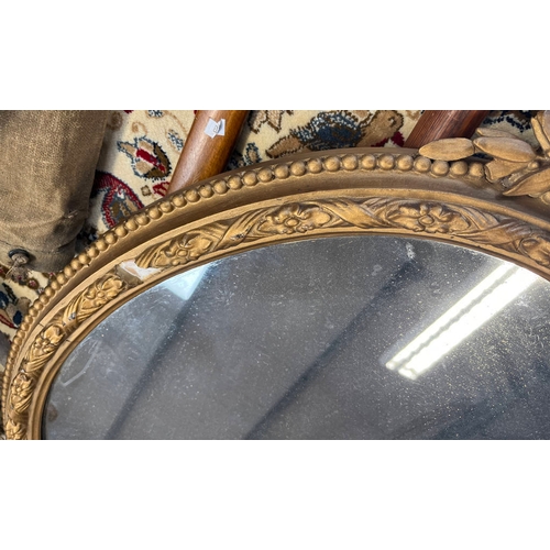 265 - 20TH CENTURY GILT FRAMED OVAL MIRROR, HEIGHT 86CM